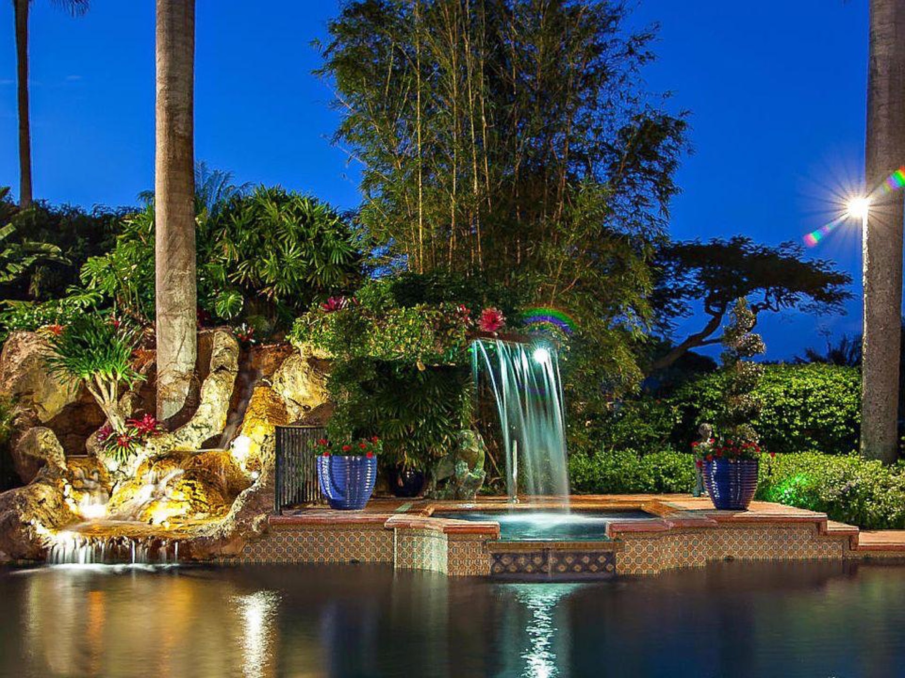 Pondless waterfall over stone into a hidden rock basin